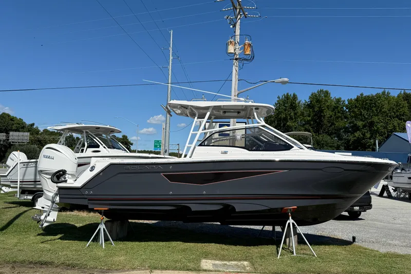 The Image of 2026 Solara S-250 DC boat displayed outdoors on a sunny day. - 1