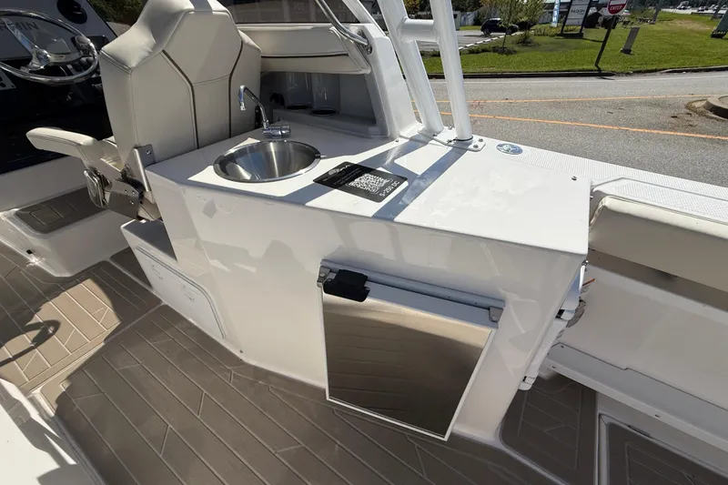 Slide: The Image of 2026 Solara S-250 DC boat interior with sink and seating area. - 15