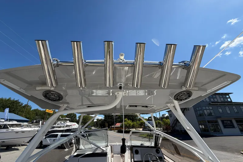 Slide: The Image of 2026 Solara S-250 DC boat with stainless steel rod holders and speakers on the roof. - 16
