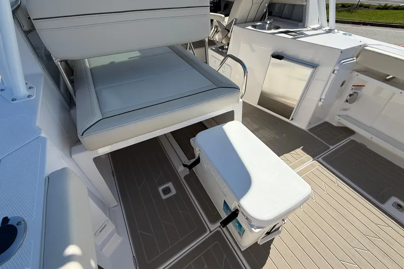 Slide: The Image of Interior of 2026 Solara S-250 DC boat with seating and storage features. - 19