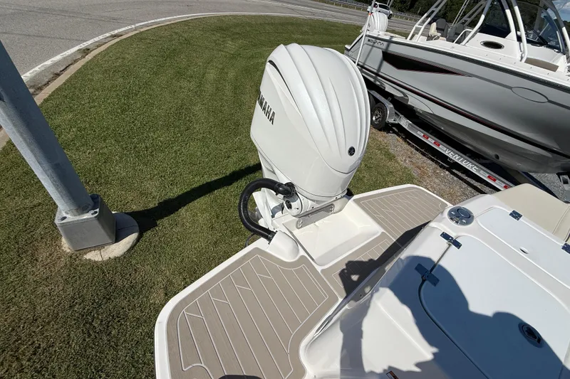 Slide: The Image of 2026 Solara S-250 DC boat with Yamaha outboard motor on a trailer. - 21