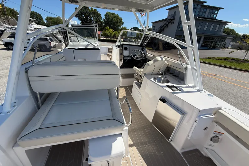Slide: The Image of 2026 Solara S-250 DC boat interior with seating, helm, and modern amenities. - 7