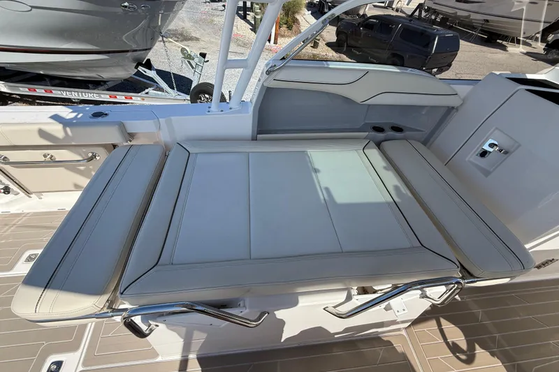 Slide: The Image of 2026 Solara S-250 DC boat interior with cushioned seating and sleek design. - 8