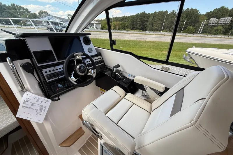 Slide: The Image of Interior cockpit of 2026 Solara S-250 C boat with modern controls and steering. - 12