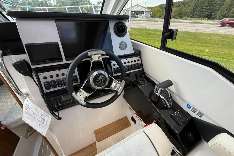 Slide: The Image of Helm of 2026 Solara S-250 C boat with modern controls and navigation screens. - 13