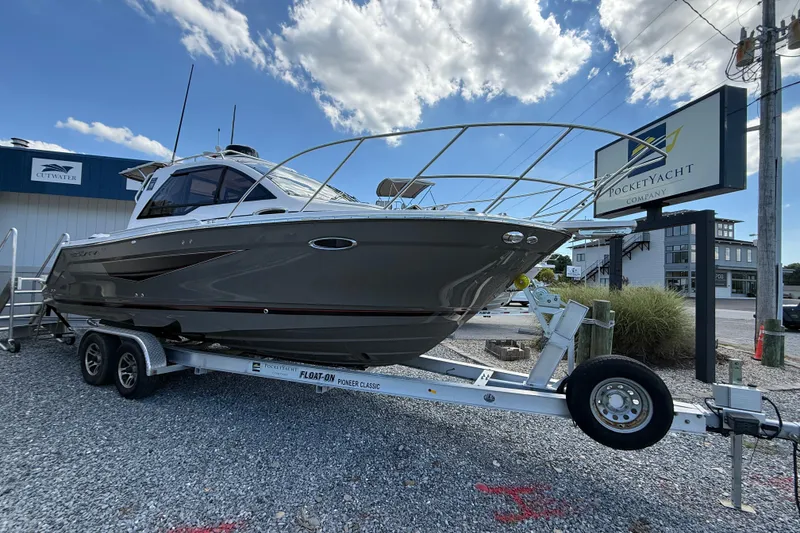 Slide: The Image of 2026 Solara S-250 C boat on trailer at Pocket Yacht Company dealership. - 4