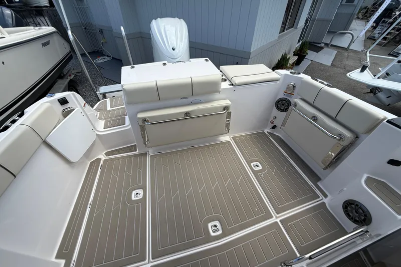 Slide: The Image of Spacious deck of 2026 Solara S-250 C boat with cushioned seating and modern design. - 7