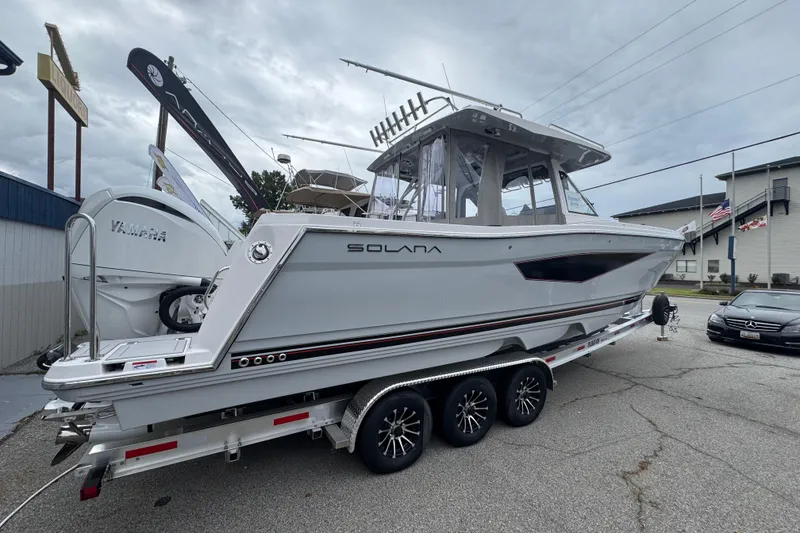 The Image of 2026 Solara S-310 CW boat on trailer, featuring sleek design and Yamaha engine. - 1