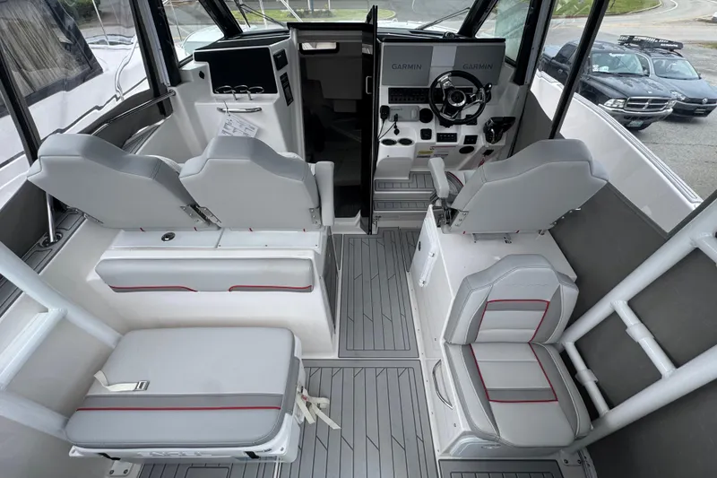Slide: The Image of Interior of 2026 Solara S-310 CW boat with modern seating and navigation equipment. - 13