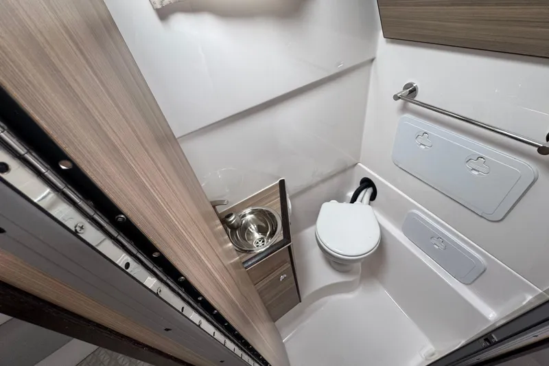Slide: The Image of Compact bathroom in 2026 Solara S-310 CW with toilet, sink, and storage. - 15
