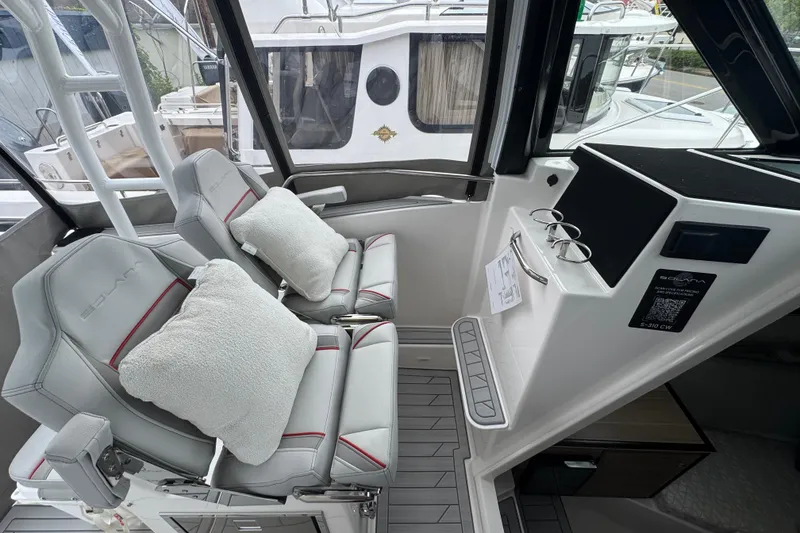 Slide: The Image of Interior of 2026 Solara S-310 CW boat with plush seating and modern dashboard. - 20