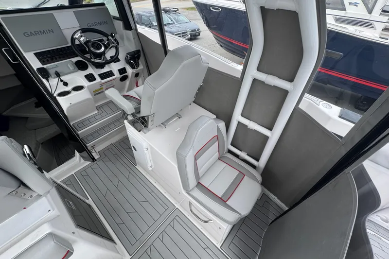 Slide: The Image of Interior of 2026 Solara S-310 CW boat with modern helm and seating. - 21