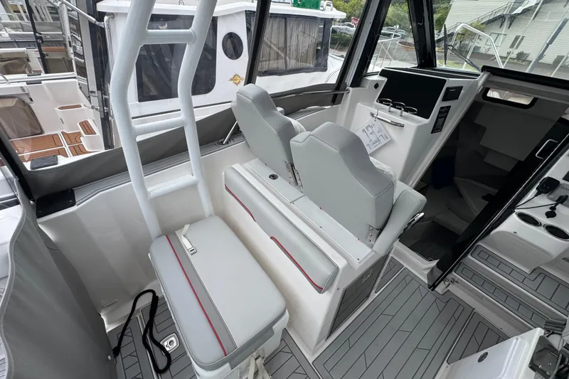 Slide: The Image of Interior of 2026 Solara S-310 CW boat with modern seating and control panel. - 22