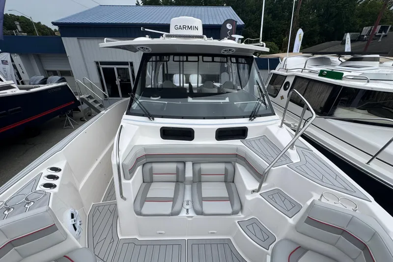 Slide: The Image of 2026 Solara S-310 CW boat with Garmin equipment, featuring spacious seating and modern design. - 27