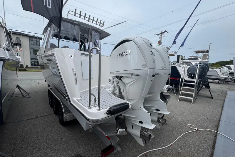 Slide: The Image of 2026 Solara S-310 CW boat with dual Yamaha outboard engines displayed outdoors. - 5