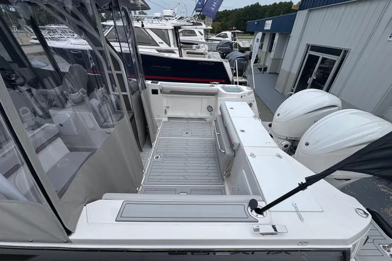 Slide: The Image of 2026 Solara S-310 CW boat with spacious deck and modern design at a marina. - 7