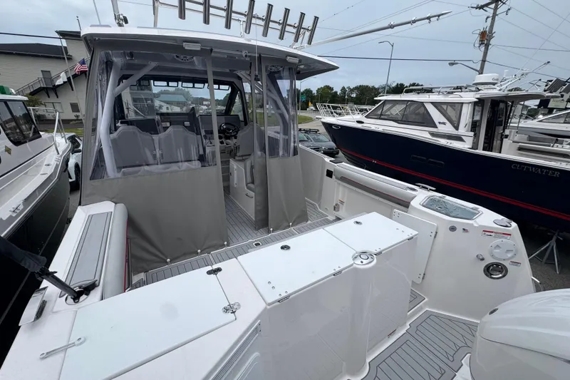 Slide: The Image of 2026 Solara S-310 CW boat with spacious deck and modern design in marina setting. - 8