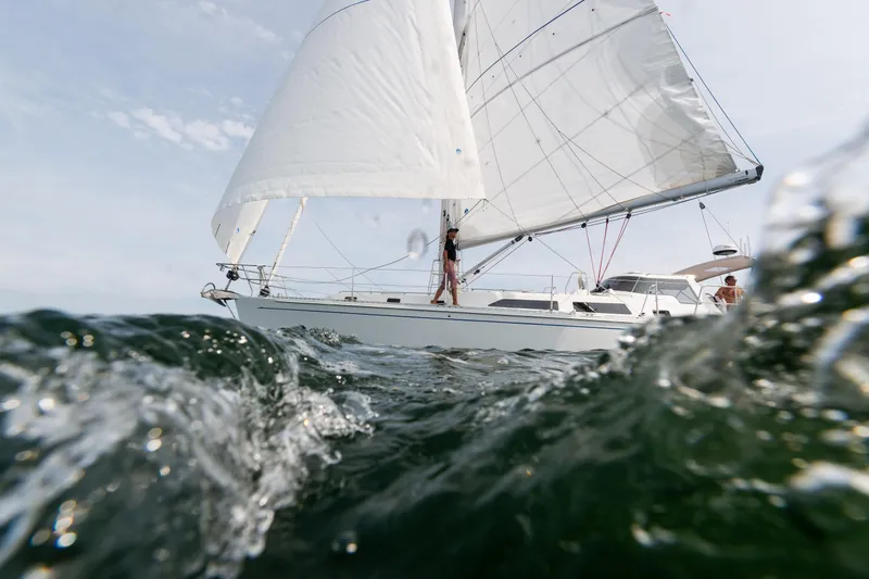Slide: The Image of Sailing yacht Outbound 46, 2024 model, navigating through ocean waves. - 8