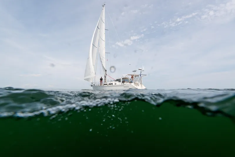 Slide: The Image of Sailboat Outbound 46 (2024) on open sea, viewed from water level. - 9
