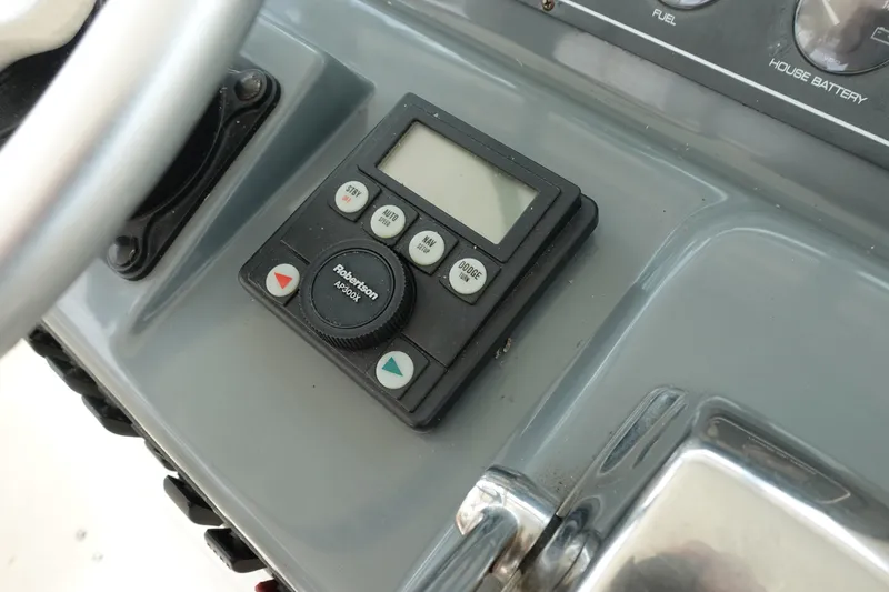 Slide: The Image of Control panel of a 1997 Pursuit 3400 Offshore boat with Robertson AP300X autopilot. - 12