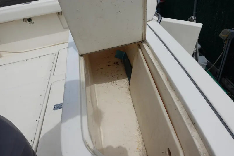 Slide: The Image of Open storage compartment on a 1997 Pursuit 3400 Offshore boat. - 18