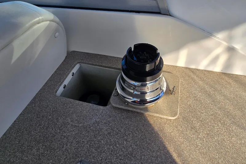 Slide: The Image of 2007 Rinker 320 Express Cruiser deck with a mounted winch. - 15