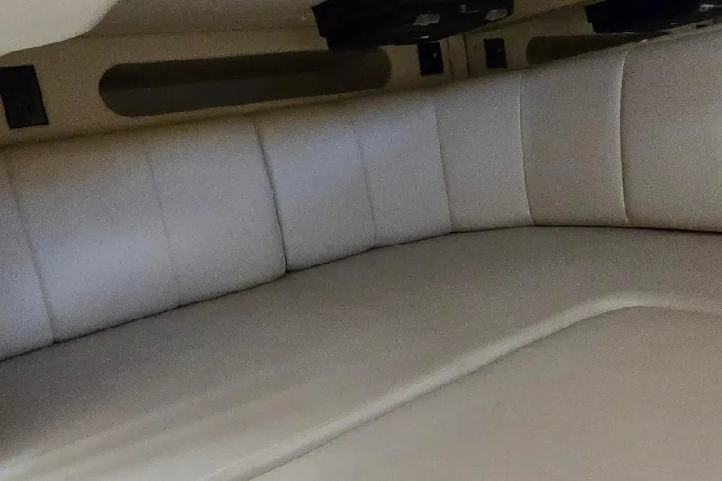 Slide: The Image of 2007 Rinker 320 Express Cruiser interior cabin with beige leather seating. - 33
