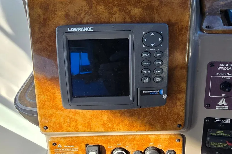 Slide: The Image of Lowrance GlobalMap 5200C on 2007 Rinker 320 Express Cruiser dashboard. - 9