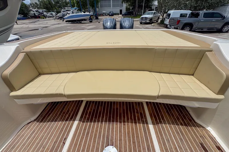 Slide: The Image of Luxurious seating on 2023 Tender Impertus 36 boat, featuring beige cushioned upholstery. - 19