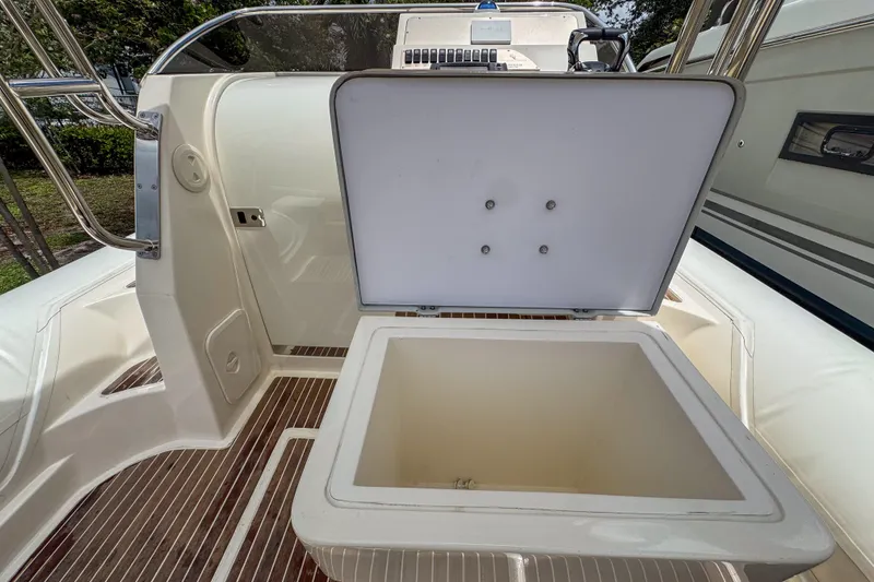 Slide: The Image of Open storage compartment on 2023 Tender Impertus 36 boat, featuring sleek design and wood flooring. - 20