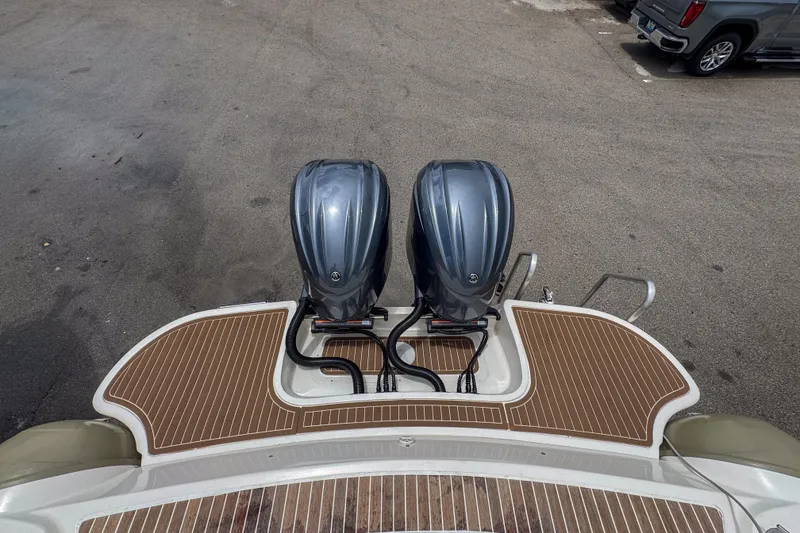 Slide: The Image of 2023 Tender Impertus 36 boat with dual outboard motors and teak deck. - 32