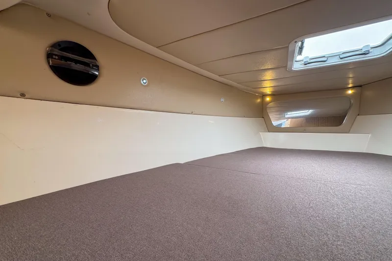 Slide: The Image of Interior cabin of 2023 Tender Impertus 36, featuring a cozy sleeping area and window. - 40