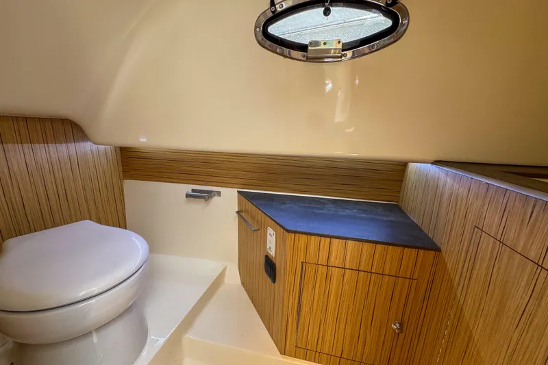 Slide: The Image of Modern bathroom interior of 2023 Tender Impertus 36 yacht with wood accents and porthole. - 41