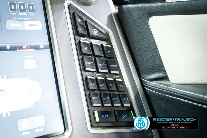 Slide: The Image of Control panel of 2025 MasterCraft X24 boat with navigation and adjustment buttons. - 45