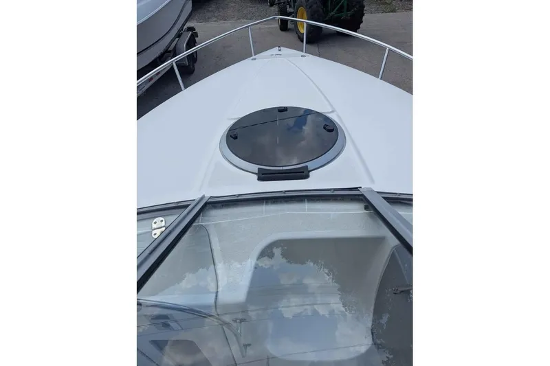Slide: The Image of 2013 Stingray 225cr boat deck with hatch and windshield view. - 8