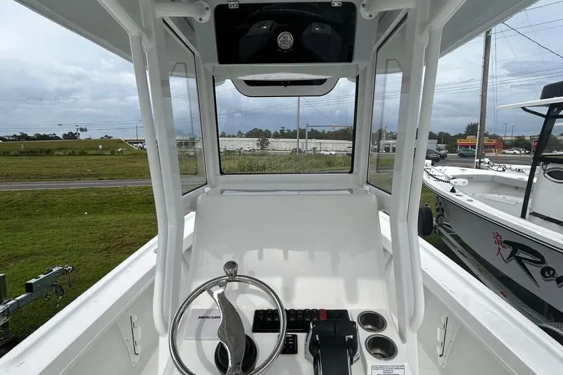 Slide: The Image of 2026 Pair Customs 27 Center Console boat interior with storage compartments and rod holders. - 17