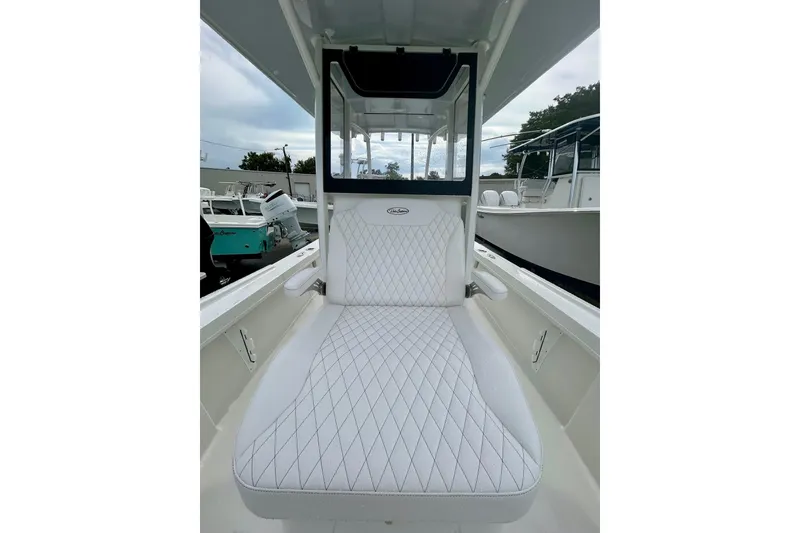 Slide: The Image of 2026 Pair Customs 27 Center Console boat with white diamond-stitched seating. - 22