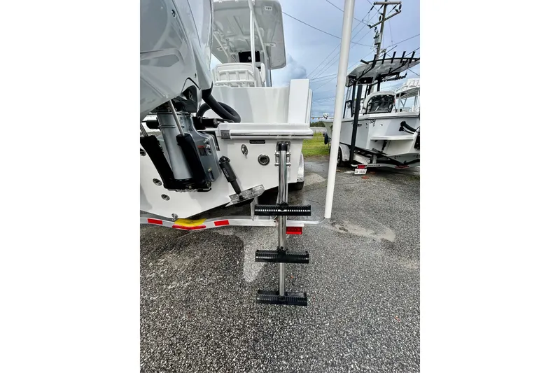 Slide: The Image of 2026 Pair Customs 27 Center Console boat with twin Mercury engines on water. - 4