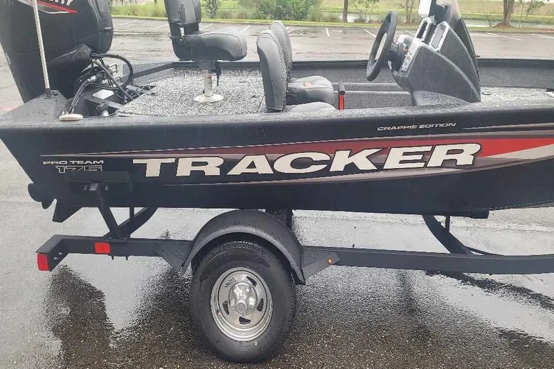 Slide: The Image of 2026 Tracker Pro Team 175 Crappie Edition boat on trailer, side view. - 3
