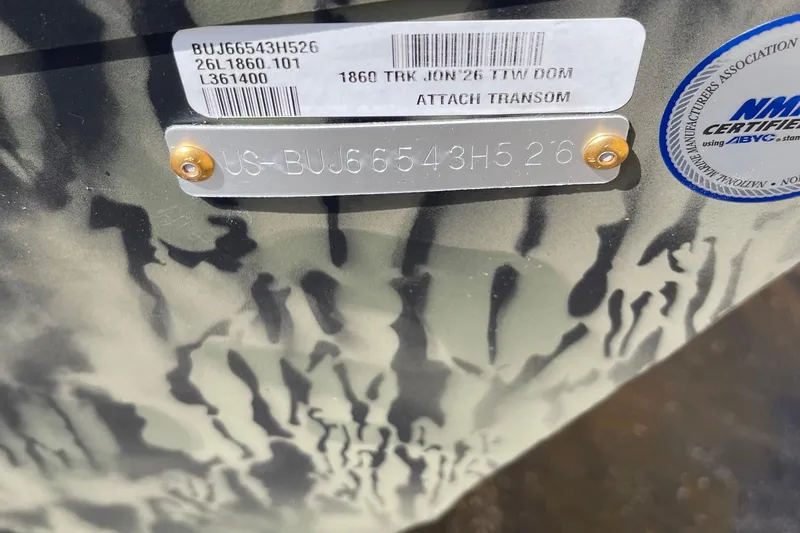 The Image of 2026 Tracker Grizzly 1860 Utility boat on trailer, parked outdoors. - 0