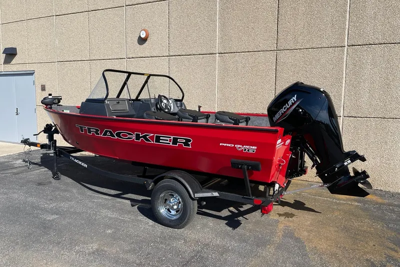 Slide: The Image of 2026 Tracker Pro Guide V-16 WT emissions control information label on red surface. - 5