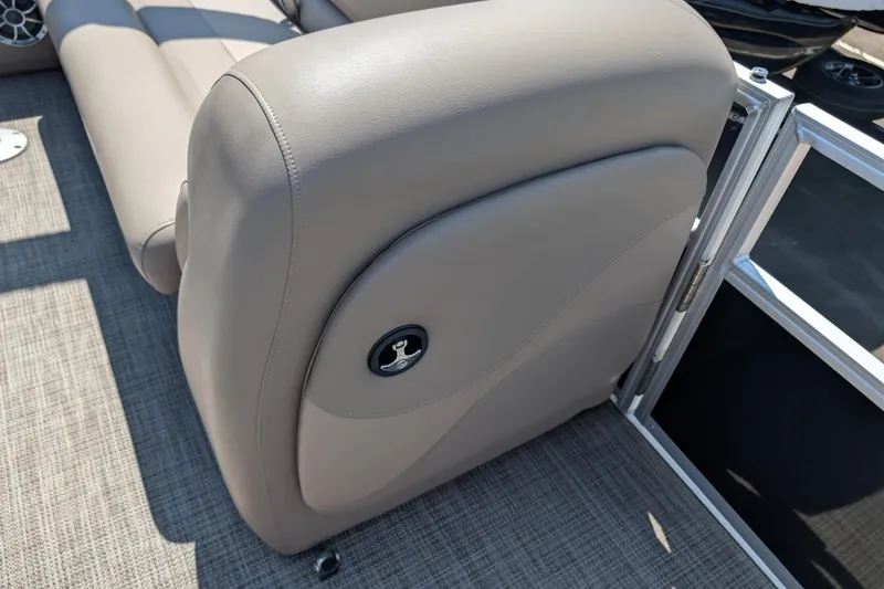 Slide: The Image of 2024 Ranger Reata 200C boat interior with beige seating and textured flooring. - 9