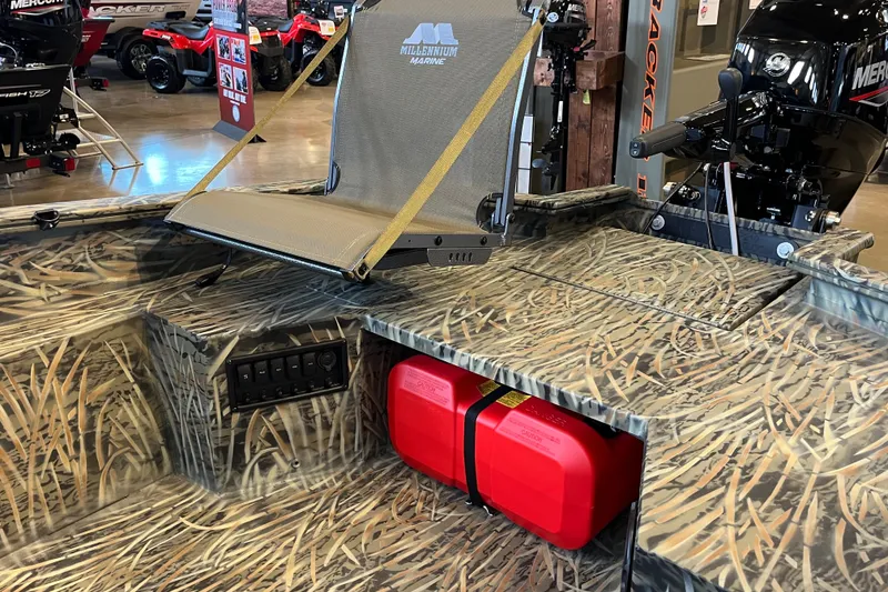 Slide: The Image of 2026 Tracker Grizzly 1654 T Sportsman boat interior with camo design and mounted seat. - 47