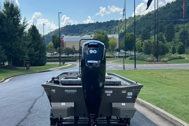 Slide: The Image of 2026 Tracker Grizzly 1860 CC boat with Mercury 90 engine on a scenic road. - 3