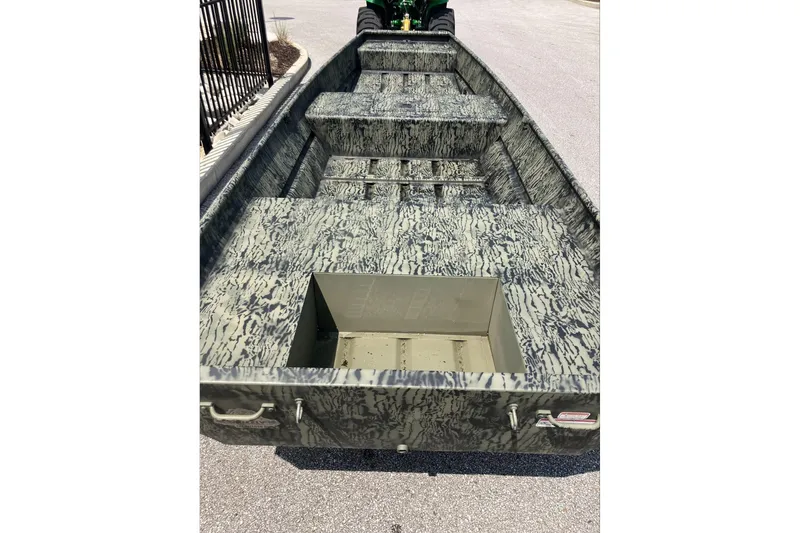 Slide: The Image of 2026 Tracker Grizzly 15 Jon boat with camouflage interior design. - 2