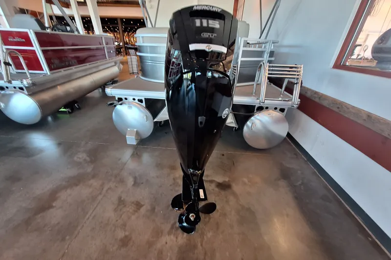Slide: The Image of 2025 Sun Tracker Party Barge 20 DLX with Mercury 115 outboard motor in showroom. - 65