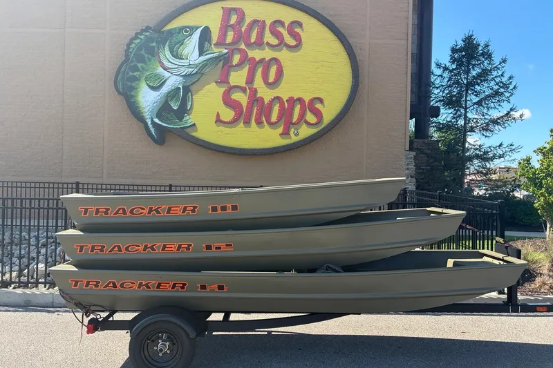 The Image of 2026 Tracker Grizzly 14 Jon boats stacked outside Bass Pro Shops. - 0