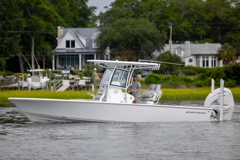 Slide: The Image of 2020 Sportsman Masters 267OE Bay Boat cruising on a scenic waterway. - 0