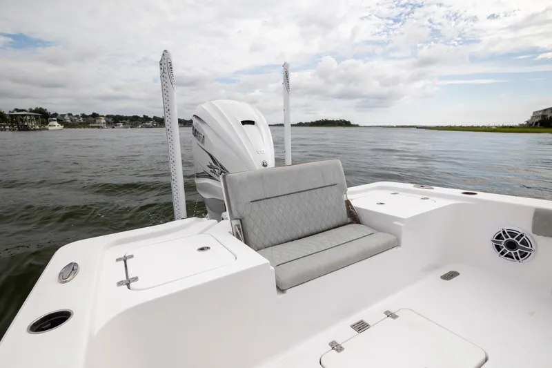 Slide: The Image of 2020 Sportsman Masters 267OE Bay Boat on calm waters, featuring a sleek design. - 10