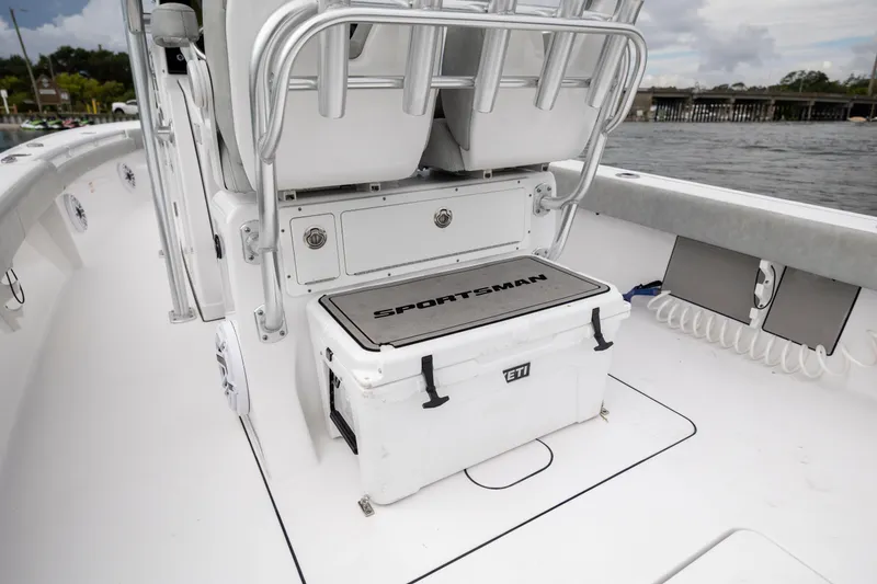 Slide: The Image of 2020 Sportsman Masters 267OE Bay Boat interior with cooler and seating. - 12